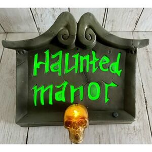 GEMMY Haunted Manor Motion-Activated Sound Light Halloween Spooky Flashing Skull